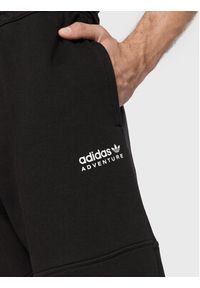 Adidas - adidas Spodnie dresowe Adventure HK5001 Czarny Regular Fit. Kolor: czarny. Materiał: bawełna, dresówka