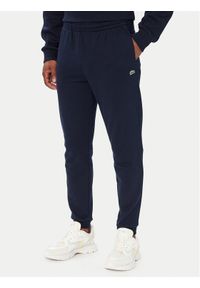 Lacoste Spodnie dresowe XH9833 Granatowy Regular Fit. Kolor: niebieski. Materiał: bawełna #1