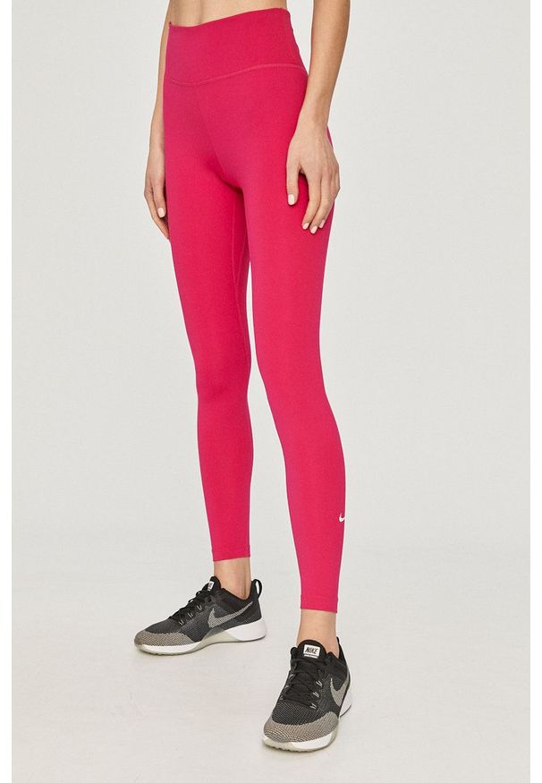 Nike - Legginsy. Stan: podwyższony. Kolor: różowy. Materiał: włókno, skóra, tkanina. Technologia: Dri-Fit (Nike)