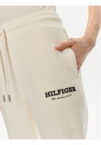 TOMMY HILFIGER - Tommy Hilfiger Spodnie dresowe Monotype WW0WW41572 Beżowy Regular Fit. Kolor: beżowy. Materiał: bawełna #3