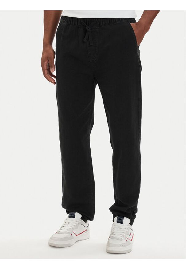 Tommy Jeans Joggery DM0DM22819 Czarny Tapered Fit. Kolor: czarny. Materiał: bawełna