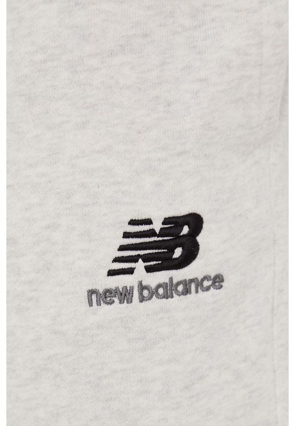 New Balance spodnie dresowe bawełniane męskie kolor szary gładkie. Kolor: szary. Materiał: dresówka, bawełna. Wzór: gładki