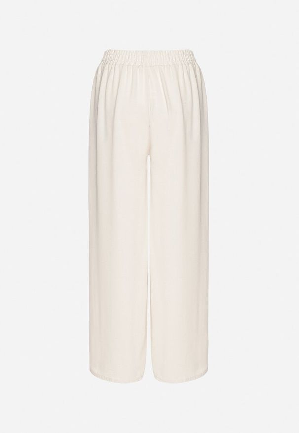 Born2be - Jasnobeżowe Szerokie Spodnie z Bawełną Wysokim Stanem i Guzikami Avelritia. Okazja: na co dzień. Stan: podwyższony. Kolor: beżowy. Materiał: bawełna. Styl: elegancki, casual, klasyczny