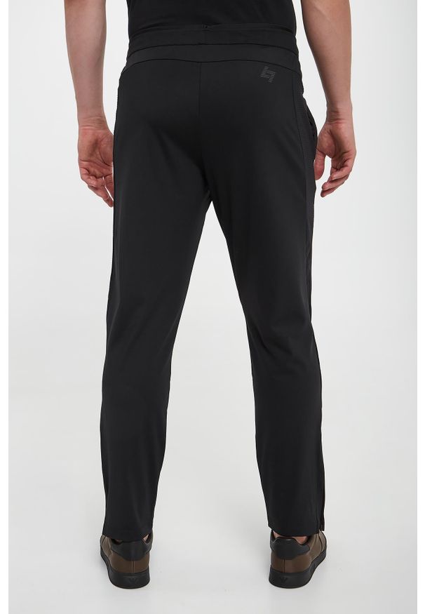 EA7 Emporio Armani - Spodnie dresowe męskie EA7 EMPORIO ARMANI. Materiał: dresówka