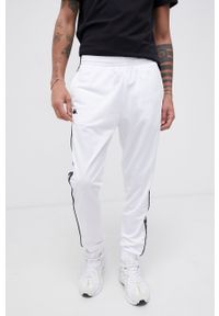 Kappa - Spodnie. Kolor: biały. Materiał: dzianina. Wzór: aplikacja