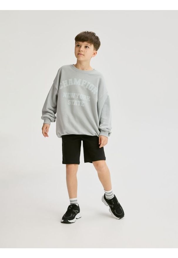 Reserved - Bawełniane szorty - czarny. Kolor: czarny. Materiał: bawełna. Wzór: gładki