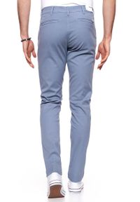 Wrangler - WRANGLER SPODNIE MĘSKIE CHINO FLINSTONE BLUE W16LHE13F. Materiał: materiał #7