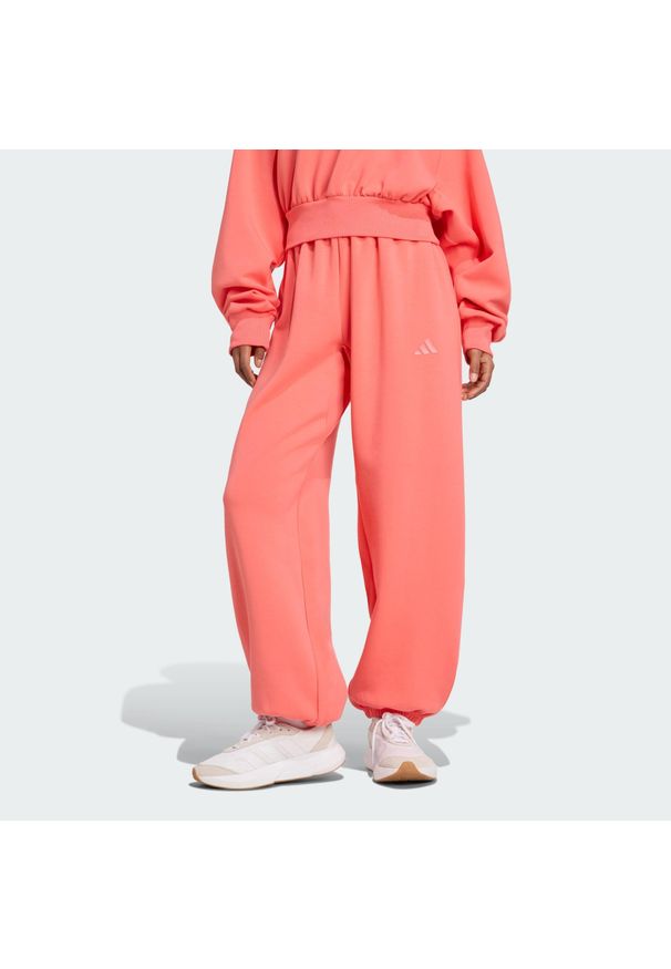 Adidas - Spodnie Soft Lux Loose. Kolor: żółty, wielokolorowy, pomarańczowy. Sport: fitness