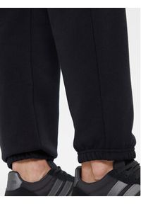 Under Armour Spodnie dresowe Ua Icon 6003676 Czarny Loose Fit. Kolor: czarny. Materiał: syntetyk