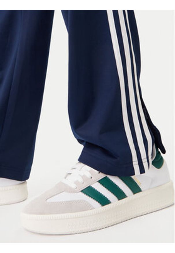 Adidas - adidas Spodnie dresowe Firebird KD8316 Granatowy Loose Fit. Kolor: niebieski. Materiał: syntetyk