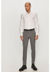 Calvin Klein - Koszula bawełniana. Typ kołnierza: kołnierzyk klasyczny. Kolor: biały. Materiał: bawełna. Długość rękawa: długi rękaw. Długość: długie. Wzór: gładki. Styl: elegancki, klasyczny #5