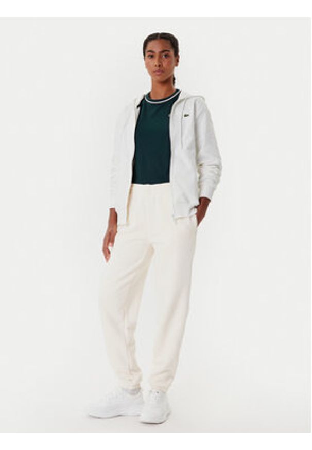 Lacoste Spodnie dresowe XF0353 Beżowy Regular Fit. Kolor: beżowy. Materiał: bawełna