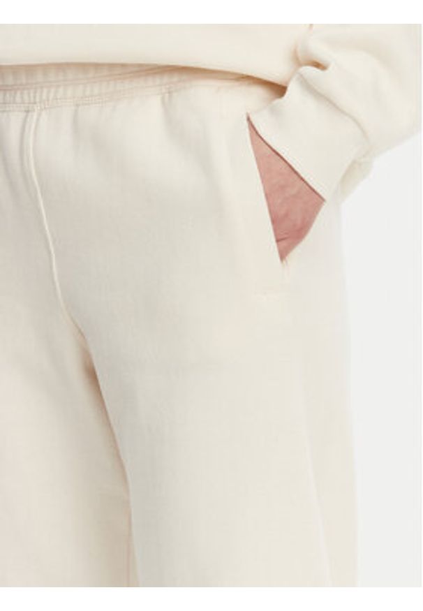 DKNY Spodnie dresowe DP5P3585 Beżowy Regular Fit. Kolor: beżowy. Materiał: bawełna