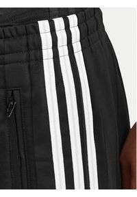 Adidas - adidas Spodnie dresowe Pinstripe Firebird KS6787 Czarny Loose Fit. Kolor: czarny. Materiał: syntetyk #2