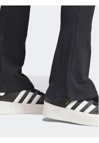 Adidas - adidas Spodnie materiałowe Essentials II8056 Czarny Flare Fit. Kolor: czarny. Materiał: bawełna #3