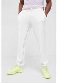 adidas Originals Spodnie H11475 męskie kolor kremowy z aplikacją. Kolor: beżowy. Materiał: bawełna, dzianina. Wzór: aplikacja #4