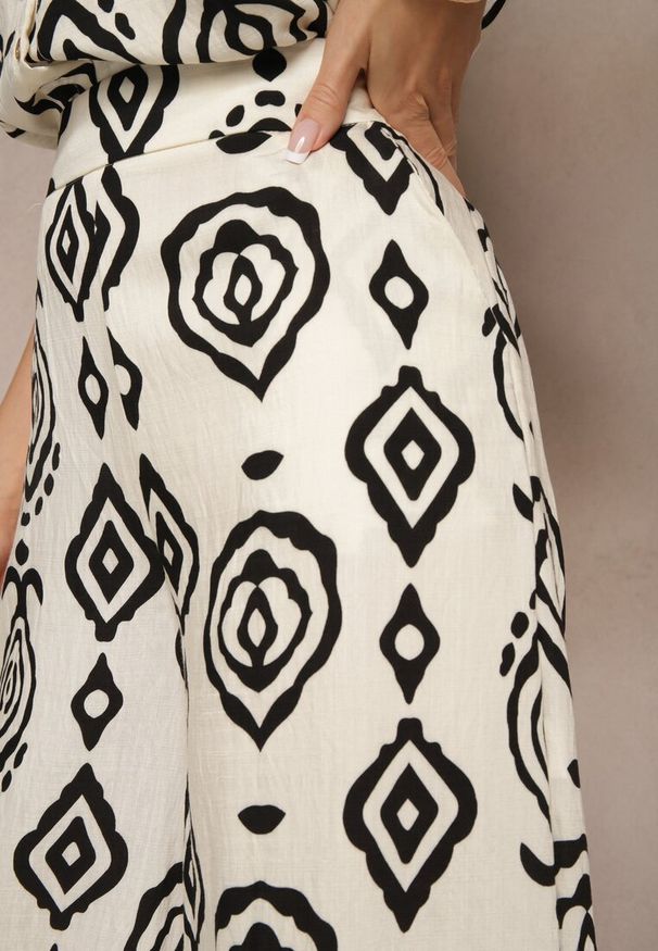 Renee - Beżowo-Czarne Spodnie z Wiskozą o Szerokim Kroju z Geometryczny Wzór Zoledia. Okazja: na co dzień. Stan: podwyższony. Kolor: beżowy. Materiał: wiskoza. Wzór: geometria. Styl: casual, elegancki