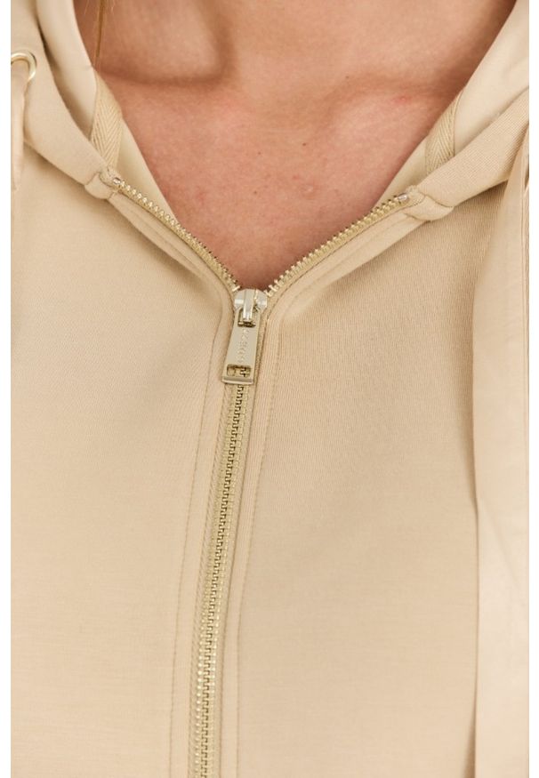 Guess - GUESS Beżowa damska bluza Hood Studs Logo, Rozmiar S. Kolor: beżowy. Materiał: wiskoza, elastan, poliester, materiał. Długość rękawa: długi rękaw. Długość: długie
