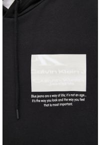 Calvin Klein Jeans bluza bawełniana męska kolor czarny z kapturem z nadrukiem. Typ kołnierza: kaptur. Kolor: czarny. Materiał: bawełna. Wzór: nadruk