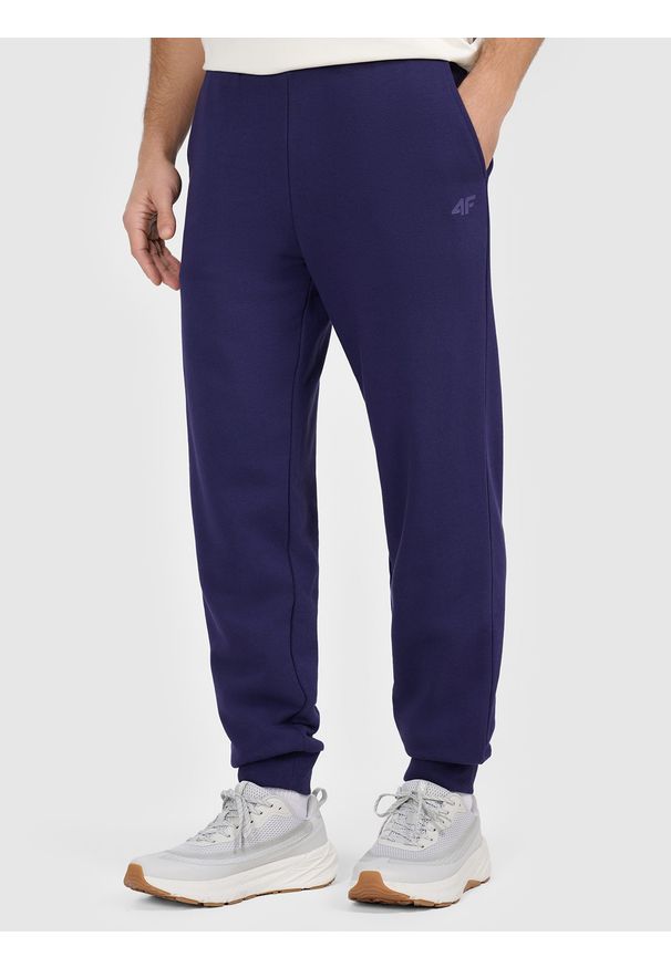 4f - 4F Spodnie dresowe joggery męskie - granatowe XL. Kolor: niebieski. Materiał: dresówka. Wzór: gładki, ze splotem