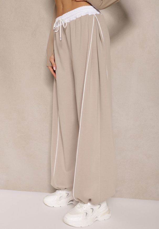 Renee - Beżowe Dresowe Spodnie z Wiskozą High Waist Ozdobione Lampasami Maiviona. Okazja: na co dzień. Stan: podwyższony. Kolor: beżowy. Materiał: dresówka, wiskoza. Wzór: aplikacja. Styl: sportowy, casual