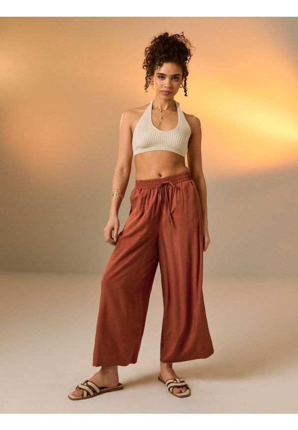 Sinsay - Wiskozowe spodnie wide leg - żółty. Kolor: żółty