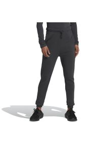 Adidas - Spodnie adidas Studio Lounge High Waist HH8514 - czarne. Stan: podwyższony. Kolor: czarny. Materiał: bawełna, materiał, lyocell, dresówka. Sport: turystyka piesza, fitness