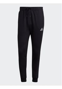 Adidas - adidas Spodnie dresowe Essentials Fleece Regular Tapered Joggers HL2236 Czarny Regular Fit. Kolor: czarny. Materiał: bawełna #5