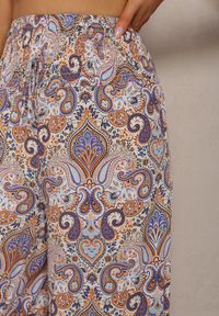 Renee - Jasnoniebieskie Spodnie z Rozszerzanymi Nogawkami z Wiskozy High Waist z Gumką w Talii Nasie. Stan: podwyższony. Kolor: niebieski. Materiał: wiskoza. Długość: długie. Styl: klasyczny, elegancki