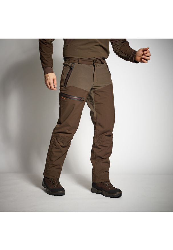 SOLOGNAC - Spodnie myśliwskie wodoodporne Solognac 900 Renfort wodoodporne. Kolor: brązowy. Materiał: tkanina, materiał