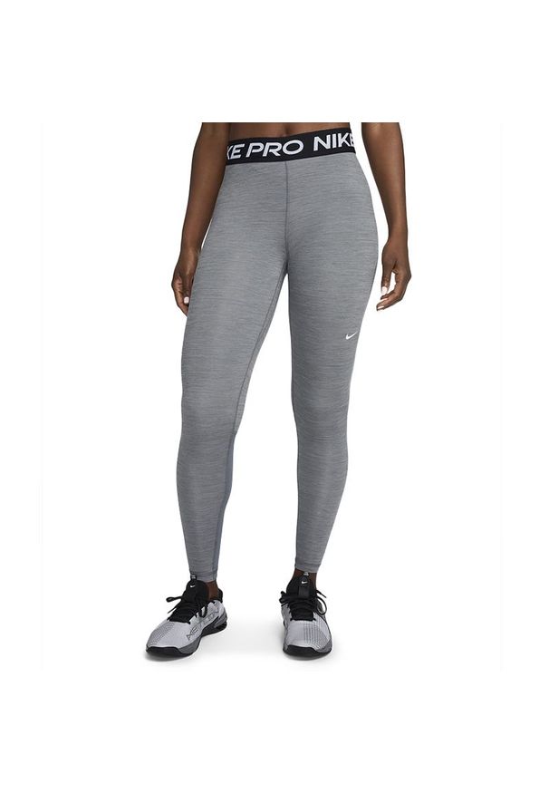 Legginsy Nike Pro CZ9779-084 - szare. Okazja: na spacer, na co dzień. Kolor: szary. Materiał: materiał, poliester, elastan. Technologia: Dri-Fit (Nike). Styl: sportowy, casual. Sport: turystyka piesza