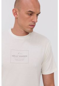Helly Hansen T-shirt męski kolor kremowy z nadrukiem. Okazja: na co dzień. Kolor: beżowy. Materiał: materiał, dzianina. Wzór: nadruk. Styl: casual