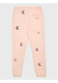 Calvin Klein Jeans Spodnie dresowe Monogram IG0IG01906 Różowy Regular Fit. Kolor: różowy. Materiał: bawełna