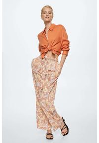 mango - Mango spodnie Nora damskie kolor pomarańczowy szerokie high waist. Stan: podwyższony. Kolor: pomarańczowy