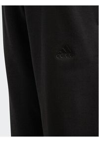 Adidas - adidas Spodnie dresowe Fleece Kids IL4937 Czarny Loose Fit. Kolor: czarny. Materiał: bawełna #5