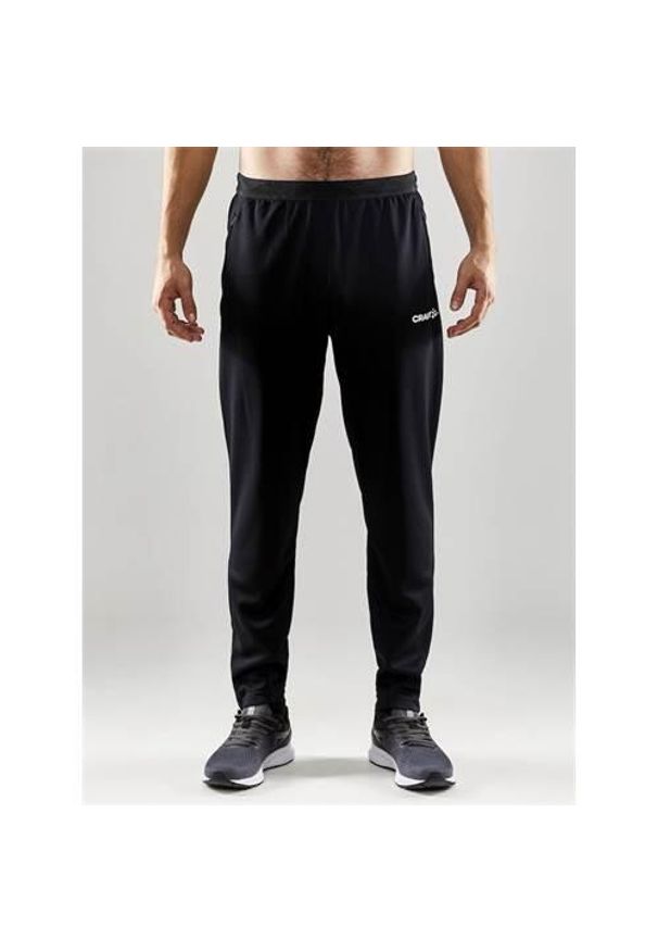 Spodnie treningowe męskie Craft Evolve Pant. Kolor: czarny. Materiał: materiał, syntetyk. Sport: fitness