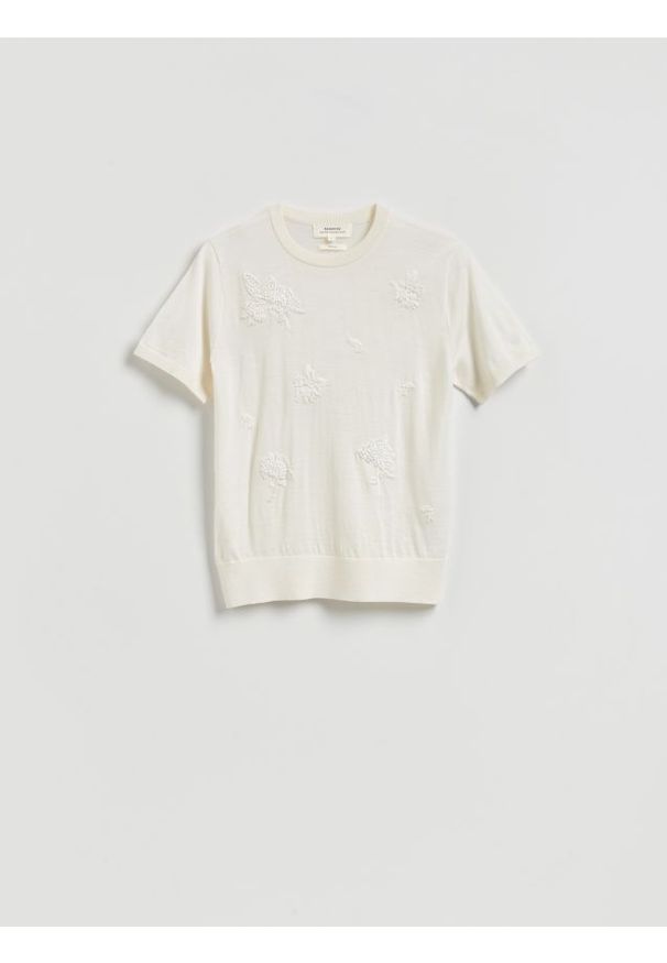 Reserved - Wełniany sweter z aplikacjami - złamana biel. Materiał: wełna. Wzór: aplikacja