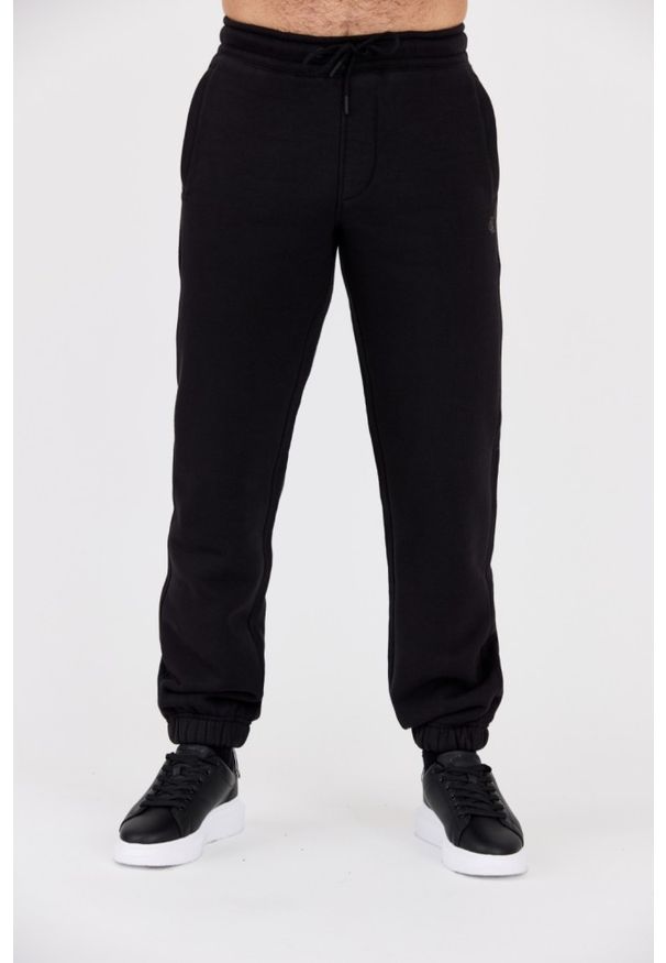 Calvin Klein - CALVIN KLEIN Czarne męskie spodnie dresowe, Rozmiar S. Kolor: czarny. Materiał: dresówka. Wzór: haft