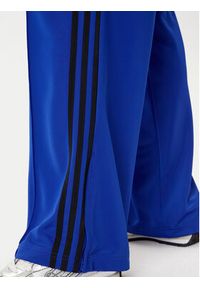 Adidas - adidas Spodnie dresowe adicolor Classic Firebird JY2693 Niebieski Loose Fit. Kolor: niebieski. Materiał: syntetyk #4
