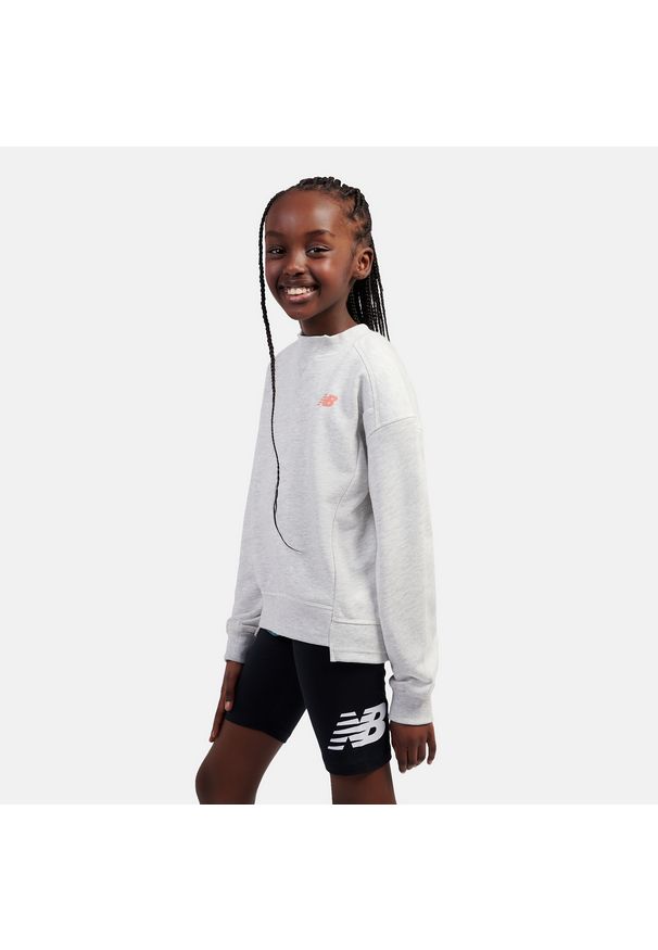 Bluza dziecięca New Balance LAKG0205AHH – szara. Kolor: szary. Materiał: poliester, bawełna. Wzór: napisy. Styl: sportowy