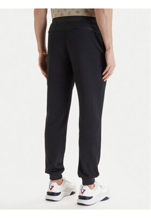 Guess Spodnie dresowe Z6GB02 K2844 Czarny Regular Fit. Kolor: czarny. Materiał: syntetyk