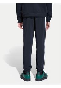 Adidas - adidas Spodnie dresowe adicolor SST KE2862 Czarny Regular Fit. Kolor: czarny. Materiał: syntetyk #5