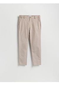 Reserved - Spodnie chino slim fit - beżowy. Kolor: beżowy. Materiał: tkanina, bawełna
