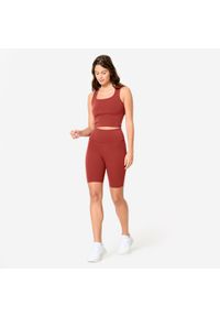 Decathlon - Koszulka fitness damska Domyos bez rękawów. Kolor: czerwony, brązowy, wielokolorowy. Materiał: poliamid, elastan, materiał. Długość rękawa: bez rękawów. Sport: fitness