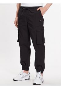 Champion Spodnie dresowe 218739 Czarny Regular Fit. Kolor: czarny. Materiał: bawełna, dresówka #1