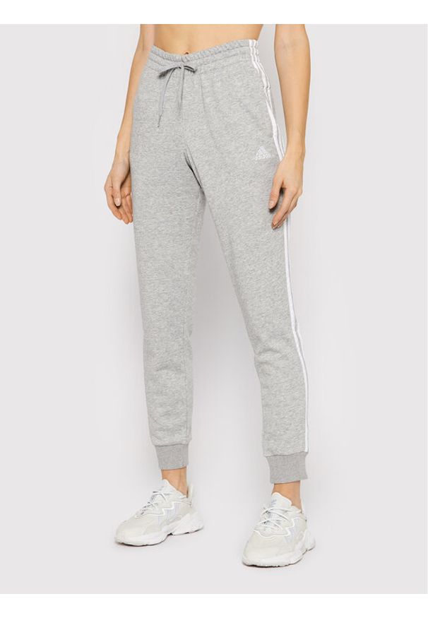 Adidas - adidas Spodnie dresowe Essentials French Terry 3-Stripes GM8735 Szary Slim Fit. Kolor: szary. Materiał: bawełna