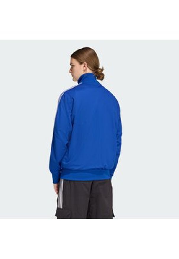 Adidas - adidas Bluza adicolor Firebird KE0790 Niebieski Loose Fit. Kolor: niebieski. Materiał: syntetyk