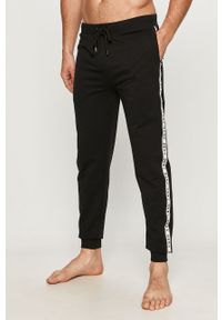 DKNY - Dkny - Spodnie piżamowe. Kolor: czarny. Materiał: bawełna, dzianina. Wzór: aplikacja #1