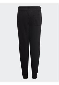 Adidas - adidas Spodnie dresowe adidas Essential 3-Stripes Joggers H65796 Czarny Regular Fit. Kolor: czarny. Materiał: bawełna #3