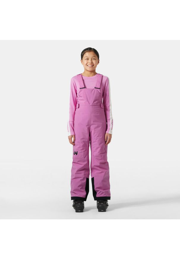 Dziewczęcy kombinezon narciarski Helly Hansen Stellar. Kolor: różowy. Sezon: zima. Sport: narciarstwo